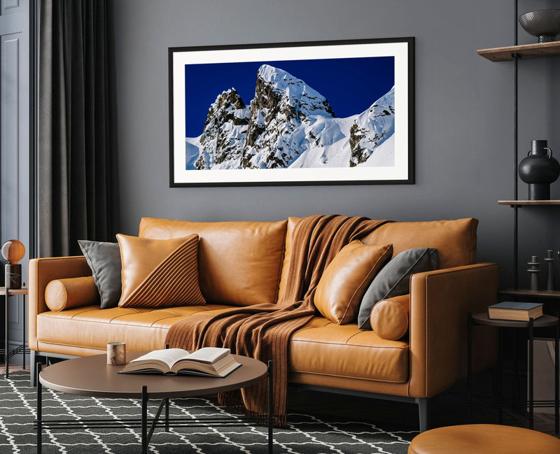 Tantalus 8 fine-art mountain photograph featuring a skier descending beneath the jagged peaks of British Columbia's Tantalus Range.