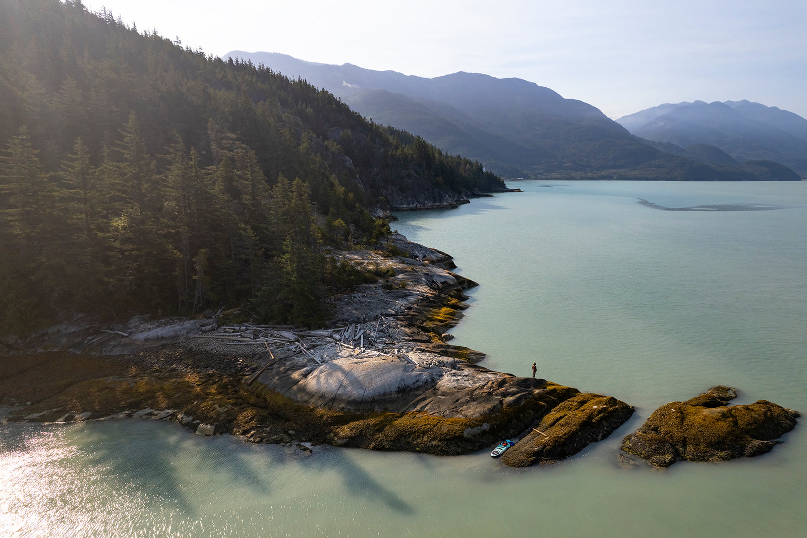 Howe Sound Passage, aerial fine art photograph of a lone paddleboarder on the turquoise fjord near Squamish, British Columbia