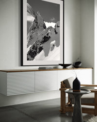 Tantalus 4 print framed above a low sideboard