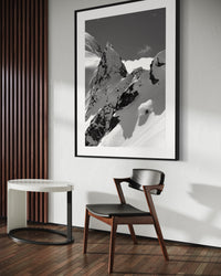 Tantalus 4 print framed above a bench beside a dining table