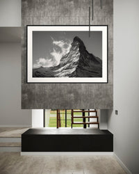 Majestic Matterhorn print framed above a fireplace on a concrete wall