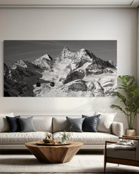 Icons of the Valais Alps panorama framed above a low sofa