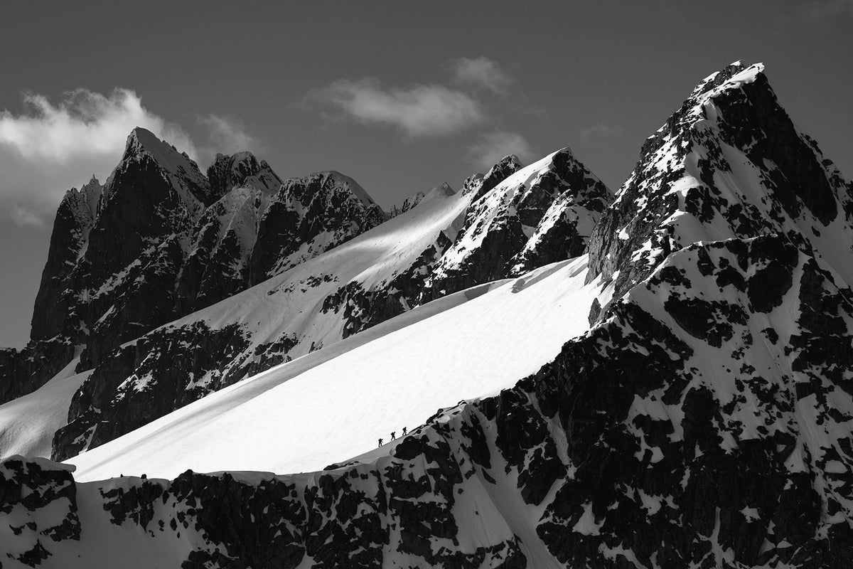 Black and white photograph of the snow covered Tantalus Range in British Columbia