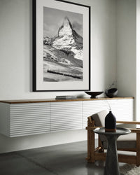 Matterhorn and the Gornergrat print framed above a long white sideboard