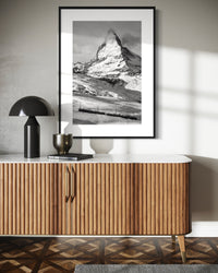 Matterhorn and the Gornergrat print framed above a wooden sideboard