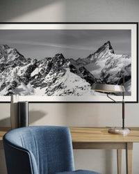 Zinalrothorn Peak 4221 m panorama framed in a living room with a blue armchair