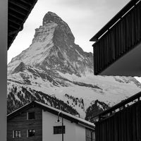 Zermatt Village, black and white Matterhorn above the rooftops of Zermatt, limited edition fine art print by Mike Crane *
