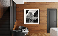 Zermatt Village print framed on a wood-panelled wall in a hallway