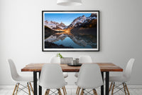 Lago Torre print framed on a wall above a dining table